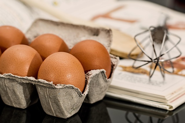 A carton of fresh brown eggs in a refrigerator, demonstrating proper storage.