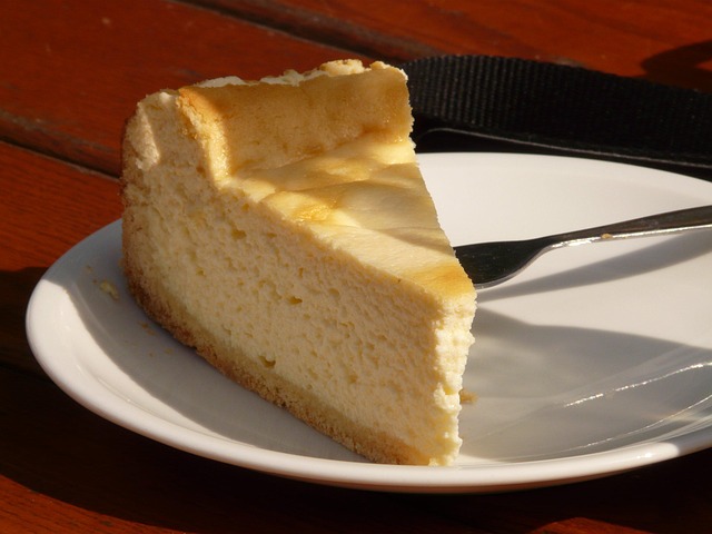 cheesecake covered with a cake dome in the fridge to keep fresh for up to 7 days